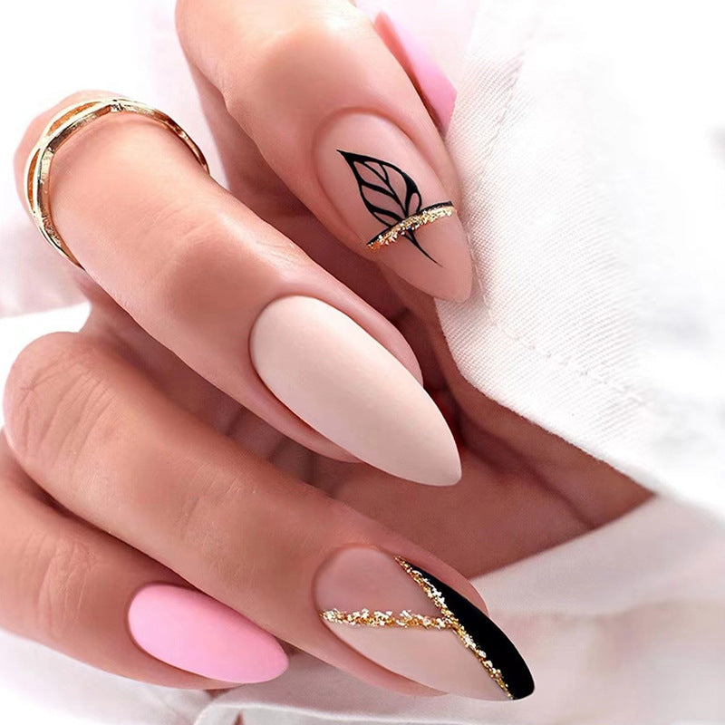 Elegant Matte Almond Stiletto Nails, Pink and Nude with Black Leaf Design, Gold Glitter Accent, Press on Nails
