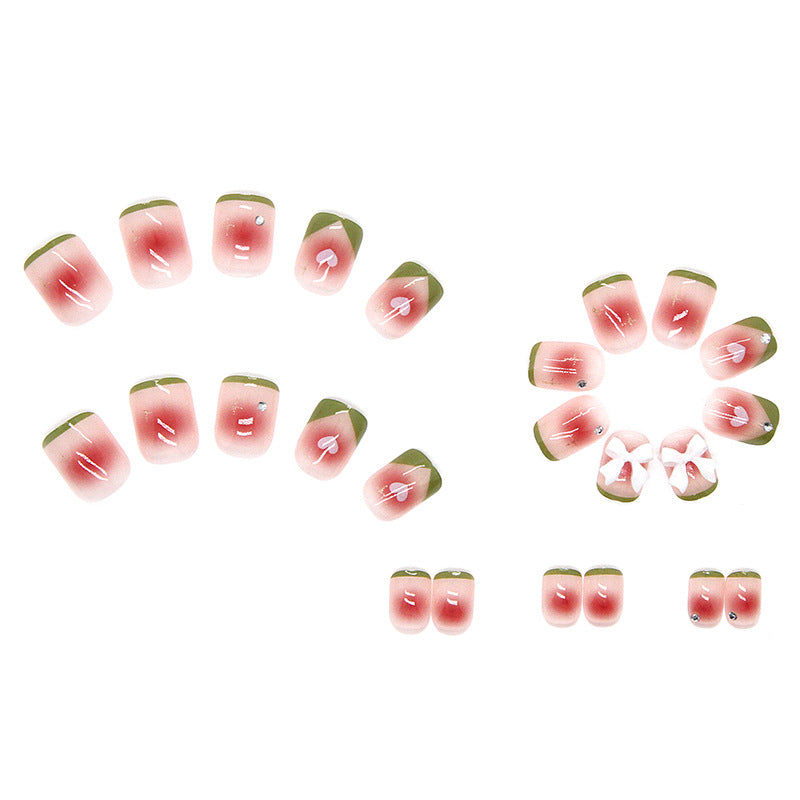 Decorative Nails with Heart and Bow Design, French Tips with Green Border, Rhinestone Accents, Press-On Nails