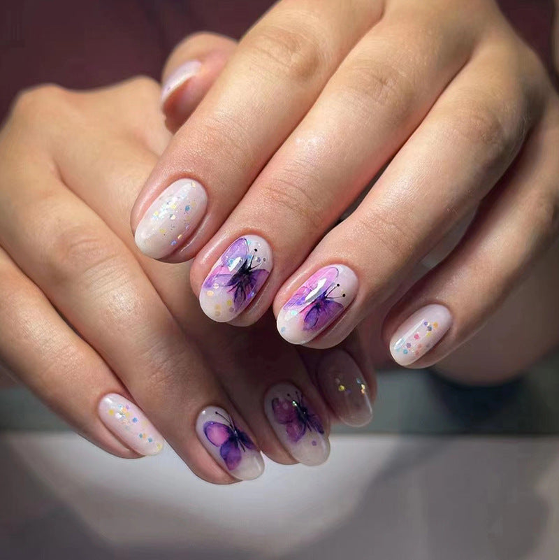 Butterfly Nail Art Design, Purple Watercolor Pattern, White Base with Glitter Accents, Press on Nails
